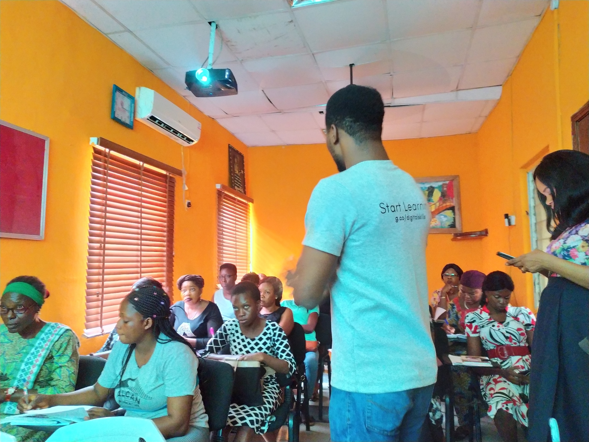 Facilitating a digital skills training session for women entrepreneurs and small business owners